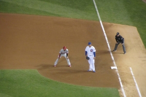 Anthony Rizzo keeps the runner close to first.